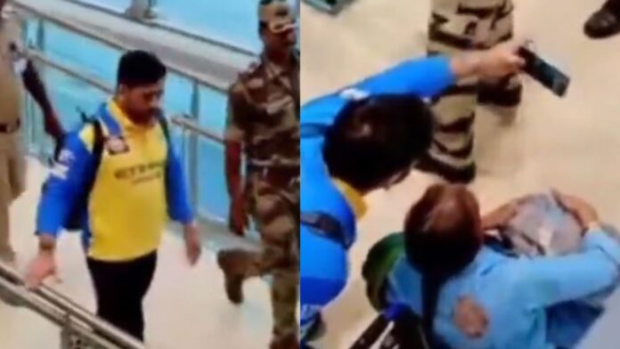 watch:-ms-dhoni-stops-to-take-selfie-with-fan-in-wheelchair-amid-airport-security