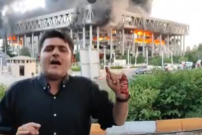 ‘don’t-know-how-many-were-killed’:-reporter-with-bloodied-hands-goes-live-as-iran-state-tv-burns
