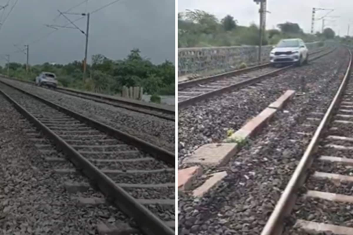woman-drives-car-on-railway-tracks-near-hyderabad,-disrupts-train-services-|-watch-bizarre-video