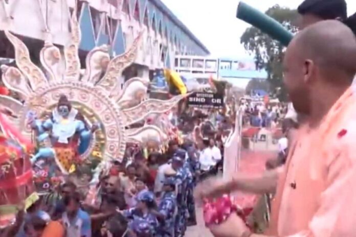 cm-yogi-welcomes-kanwariyas-with-flower-showers-in-meerut-|-watch