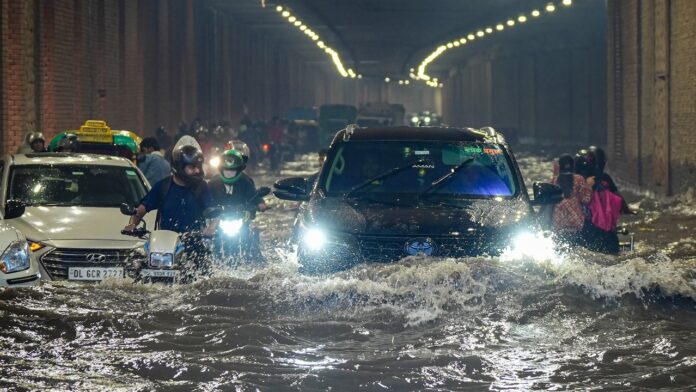 rain-paralyses north india,-dozens-dead,-key-roads-flooded,-houses-washed-away